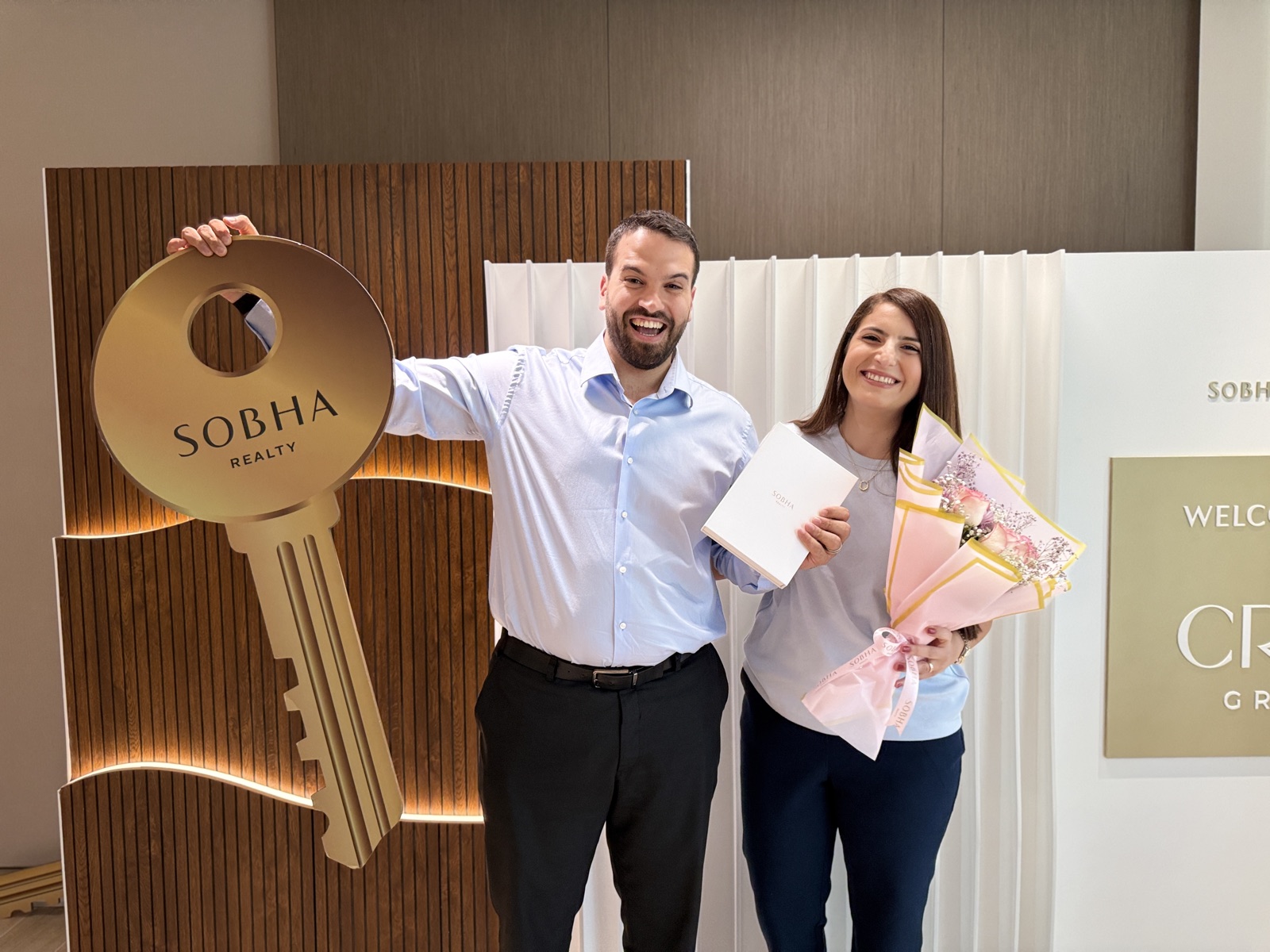 Oday and Yasmeen handing over keys at Sobha Realty
